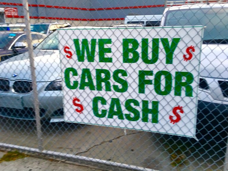 We buy cars sign.